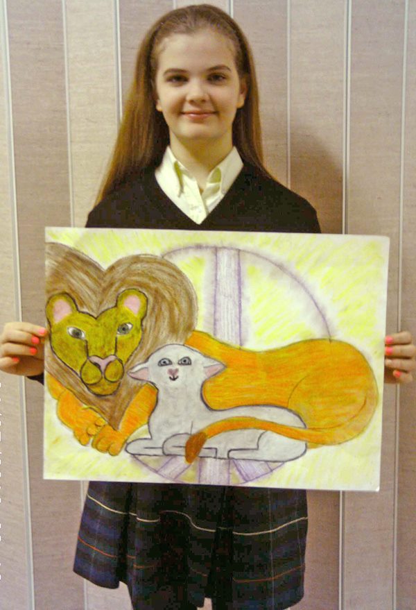 This is Hillary, a student at the St. John the Evangelist School in Attleboro. She designed this winning peace poster! 